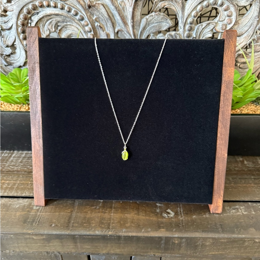 Green stone silver toned necklace. 18 inch chain. New with tag.